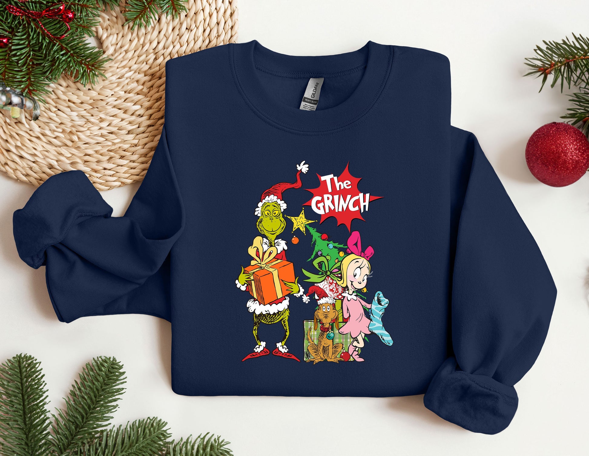 a christmas sweater with the grinch characters on it