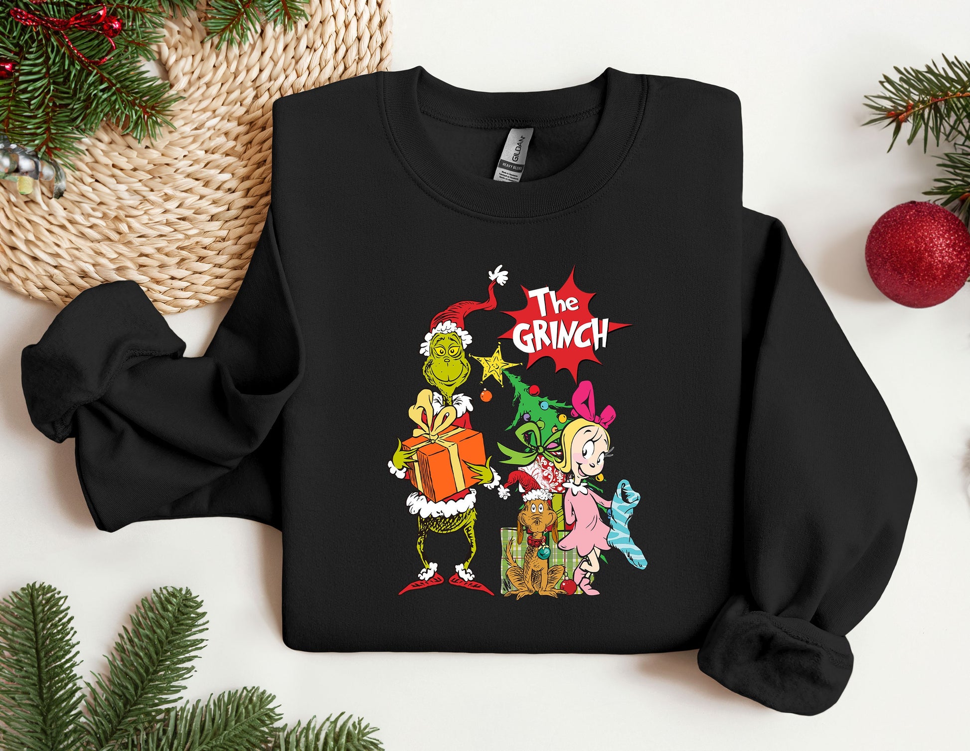 a black sweatshirt with the grinch characters on it