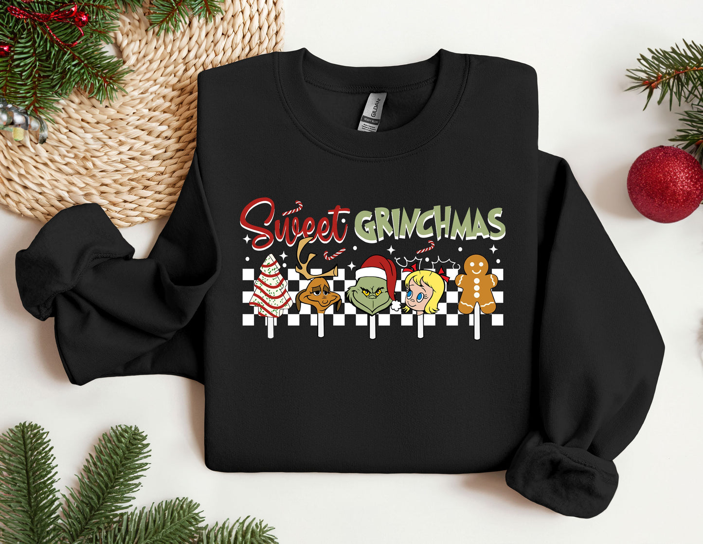 a black sweater with the words sweet grinmas on it