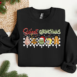 a black sweater with the words sweet grinmas on it