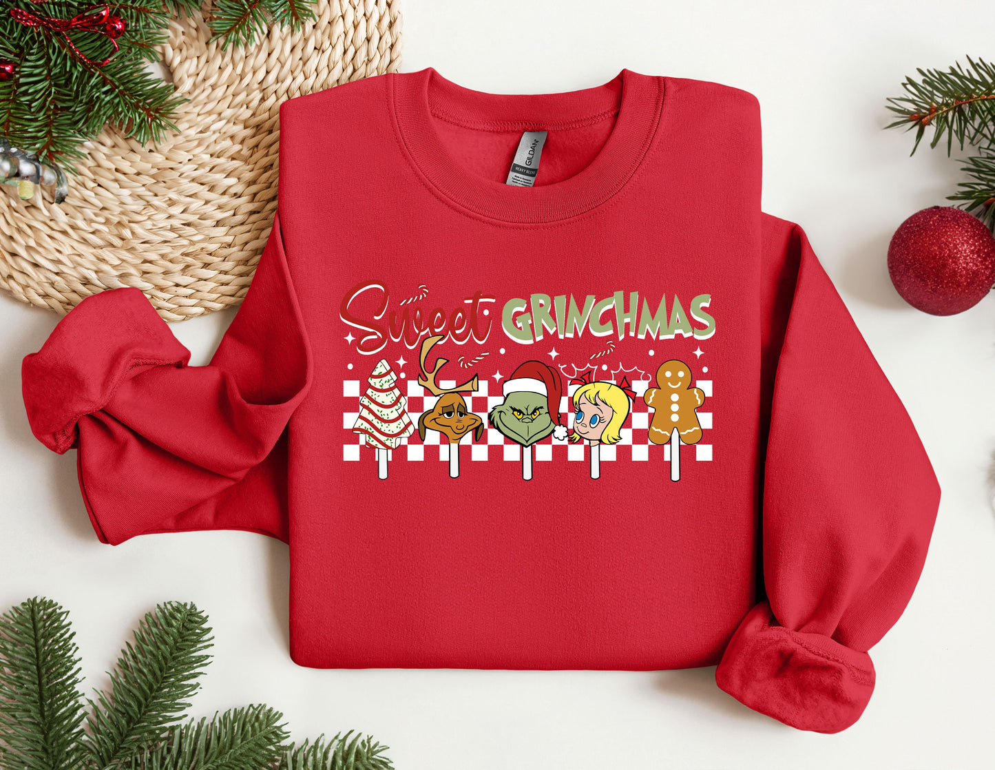 a red sweater with a christmas message on it