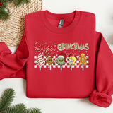a red sweater with a christmas message on it