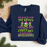 a christmas sweater with the grin saying just so we're clear the grin never
