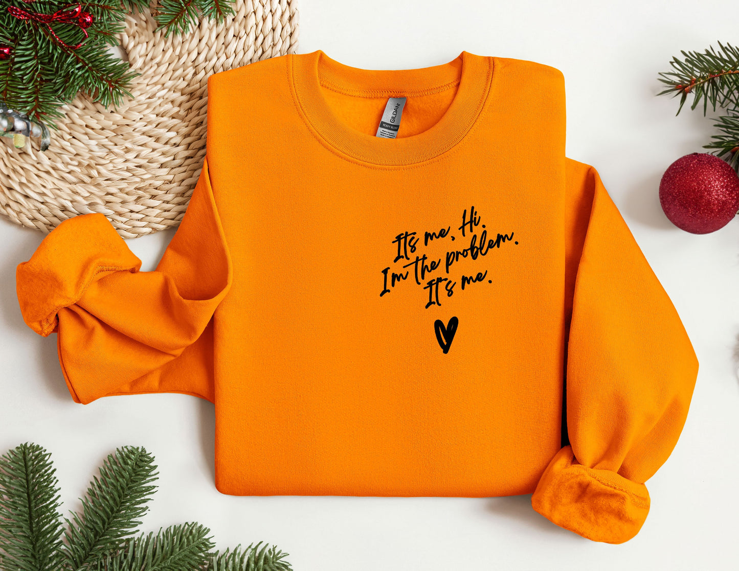 an orange sweater with a message written on it