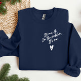 a blue sweatshirt with a heart on it