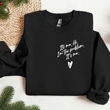 a black sweatshirt with a heart on it