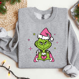 a grey sweatshirt with a picture of the grin face wearing a santa hat
