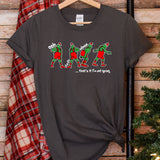 a t - shirt hanging on a wall next to a christmas tree
