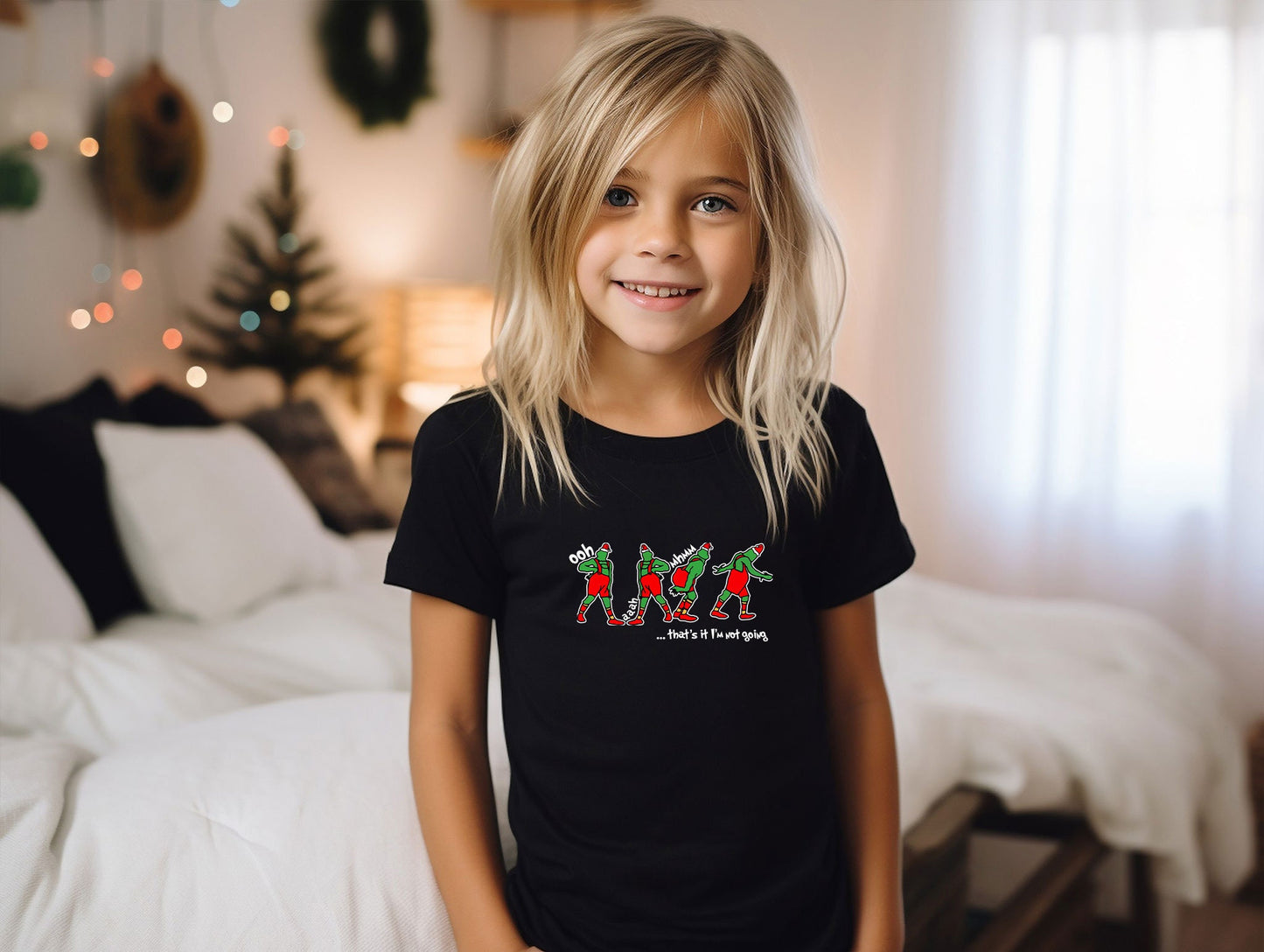 a little girl that is standing in front of a bed