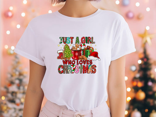 a woman wearing a t - shirt that says just a girl who loves christmas