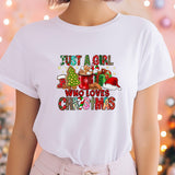 a woman wearing a t - shirt that says just a girl who loves christmas
