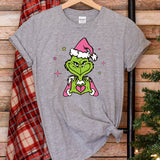 a t - shirt with the grin face on it