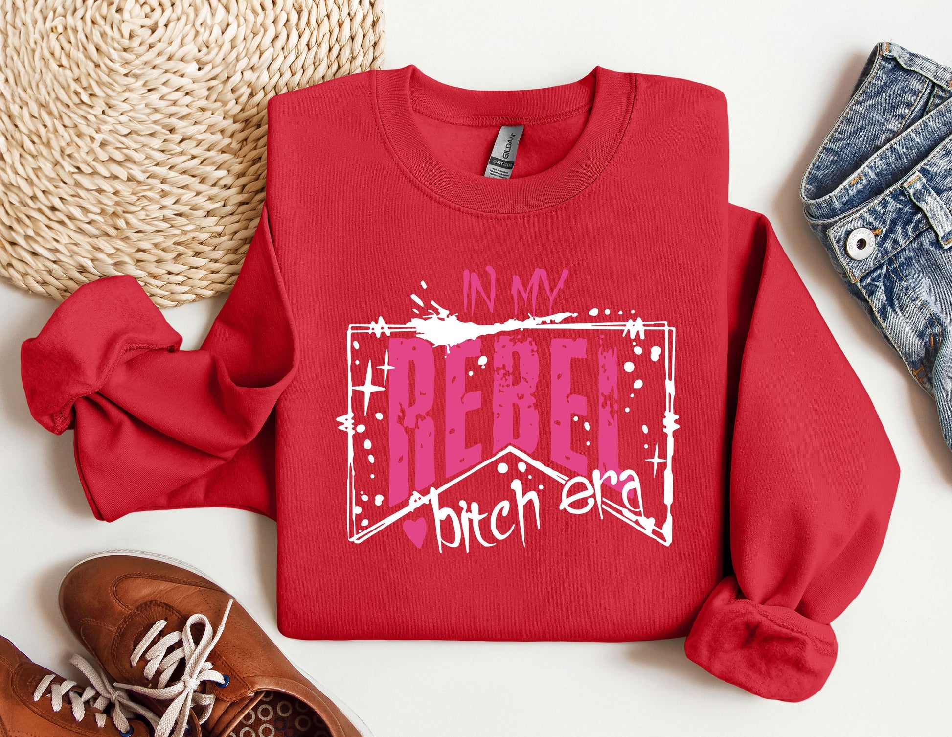 a red sweatshirt with the words in my heart, and a pair of sneakers