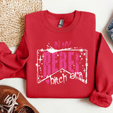 a red sweatshirt with the words in my heart, and a pair of sneakers