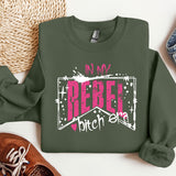 a green sweatshirt with the words in my rebel written on it