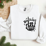 a white sweatshirt with a black rockin'n'roll design on it