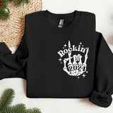 a black sweatshirt with a rockin'in the 90's design on it