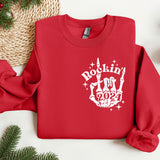 a red sweatshirt with a rockin'n'rollin'hand on it
