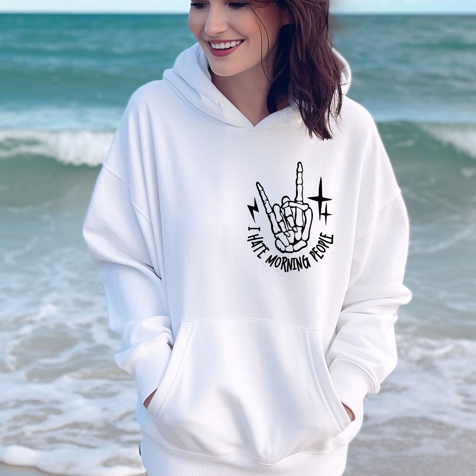 a woman wearing a white hoodie with a peace sign on it