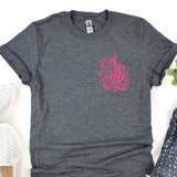a t - shirt with a pink design on it