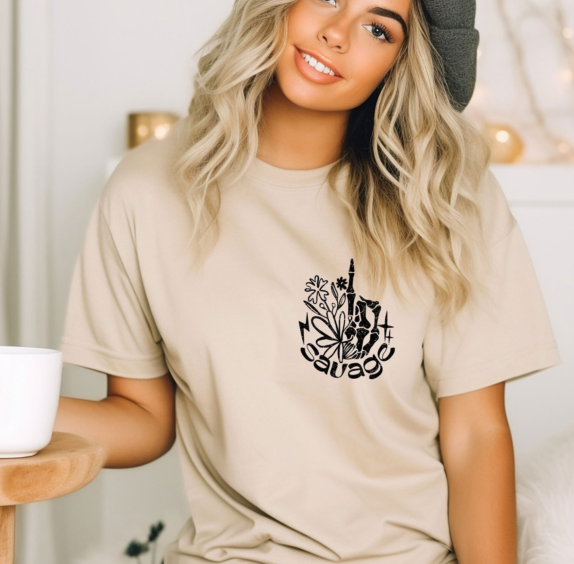 a woman sitting on a bed with a cup of coffee