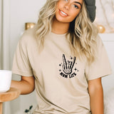 a woman wearing a t - shirt with a peace sign on it