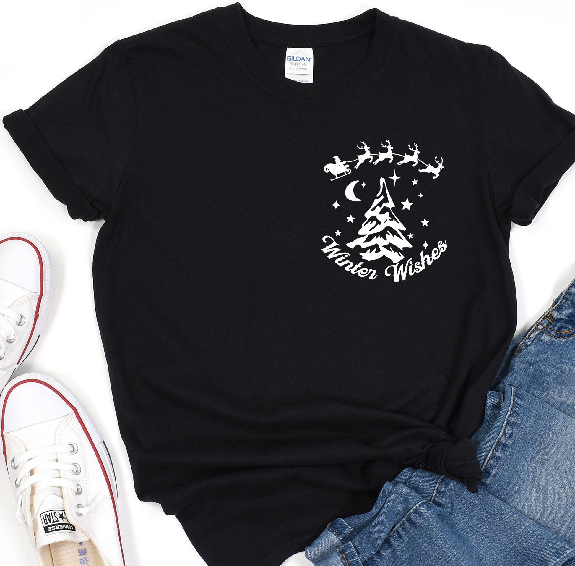 a black t - shirt with a christmas tree and santa&#39;s sleigh