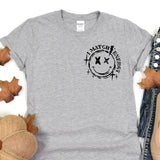 a t - shirt with a smiley face on it