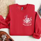 a red sweatshirt with a white design on it