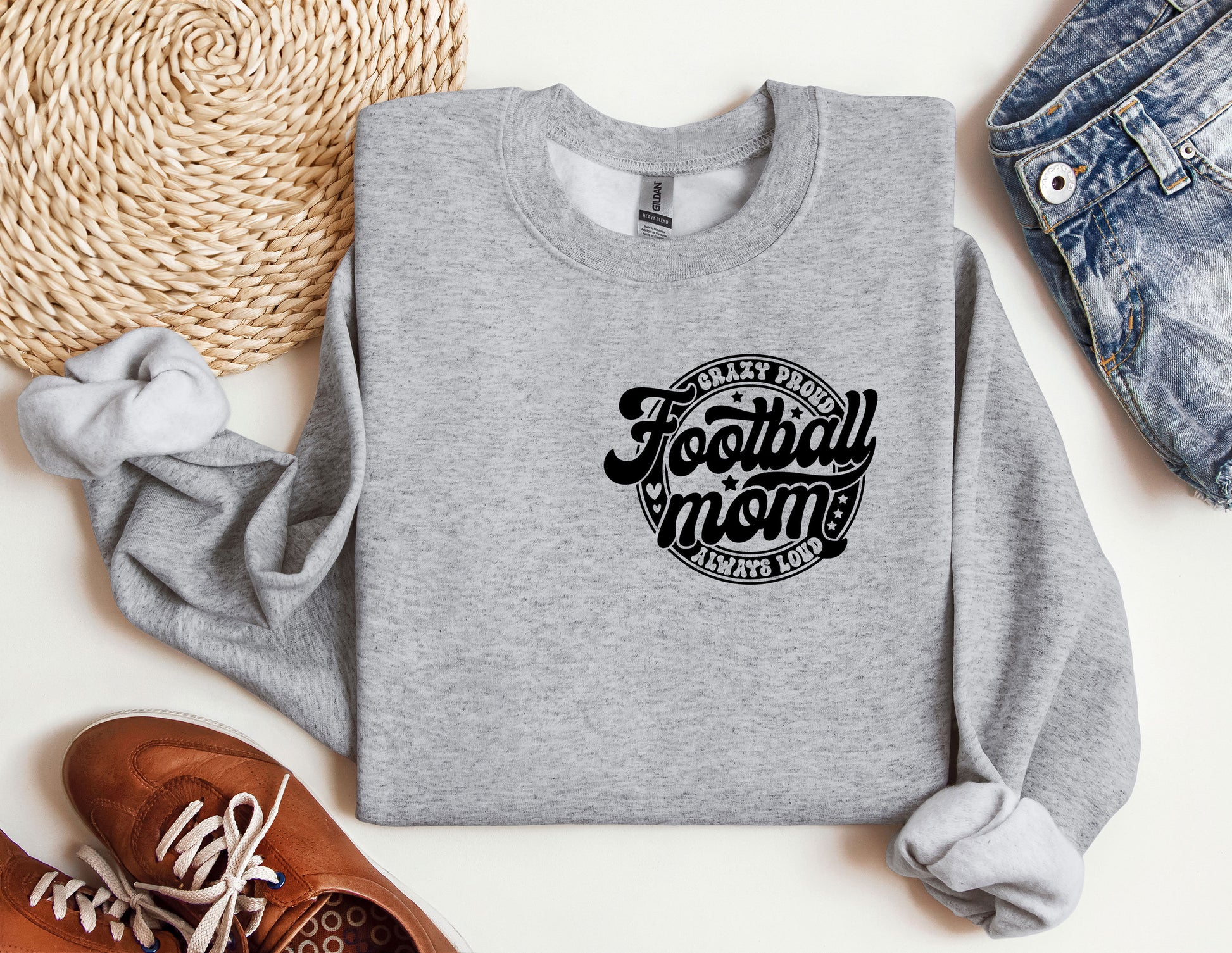 a sweatshirt with the words football mom on it