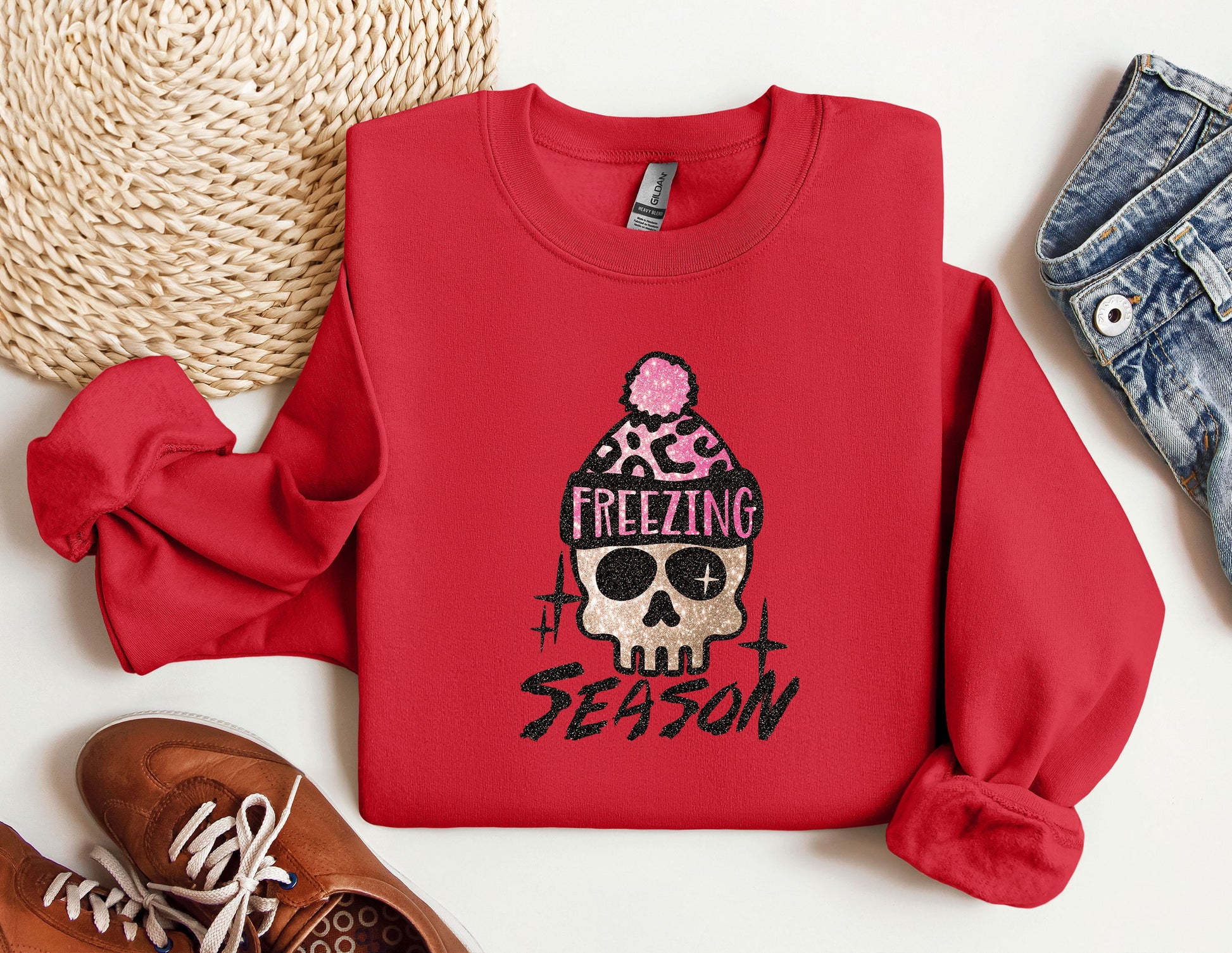 a red sweater with a skull wearing a hat