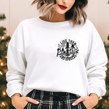 a woman standing in front of a christmas tree