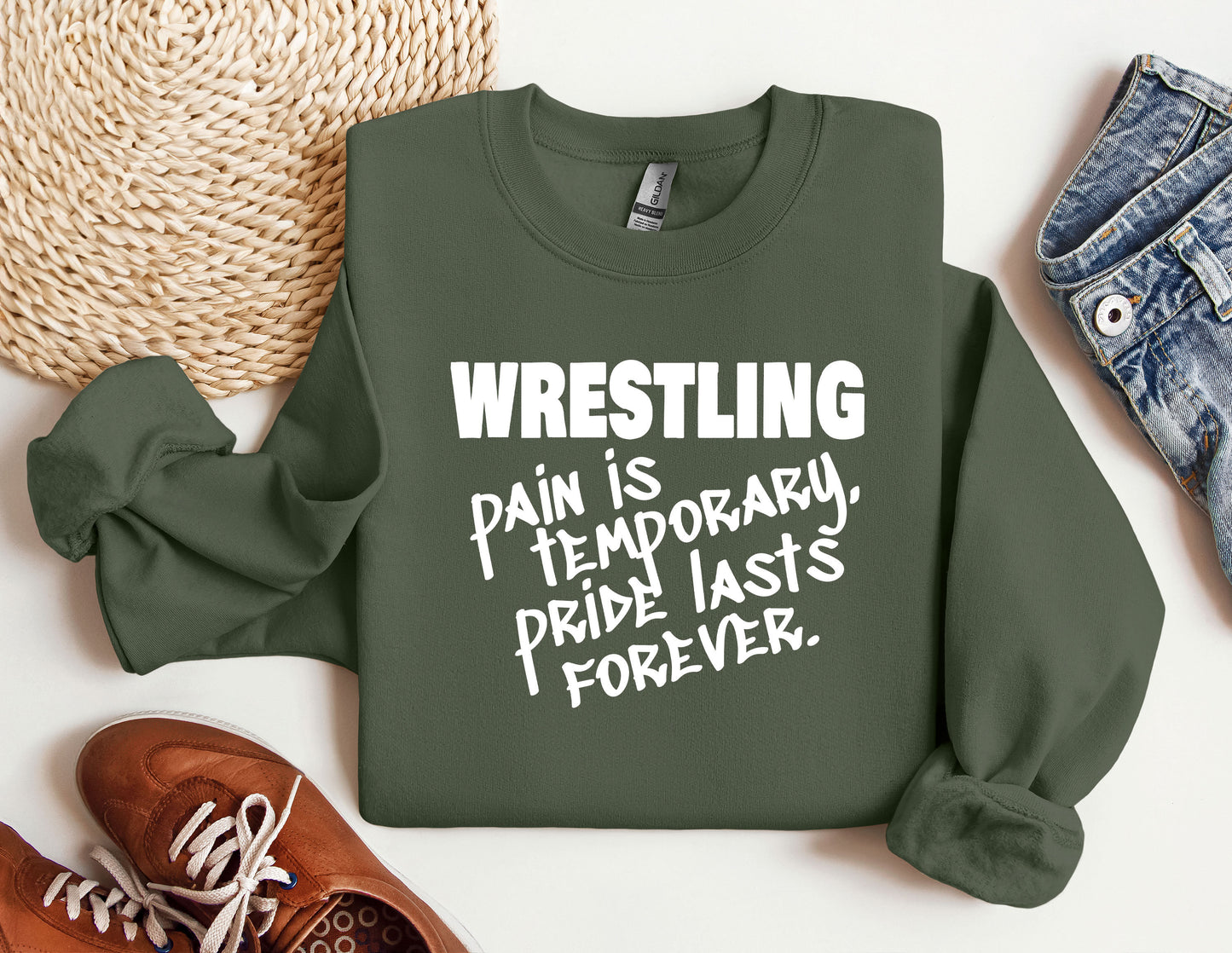 a green sweatshirt that says wrestling pain is temporary