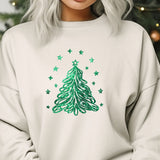 a woman wearing a white sweatshirt with a green christmas tree on it