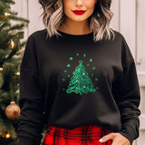 a woman wearing a black sweatshirt with a green christmas tree on it
