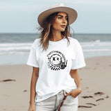 a woman wearing a hat and a white shirt