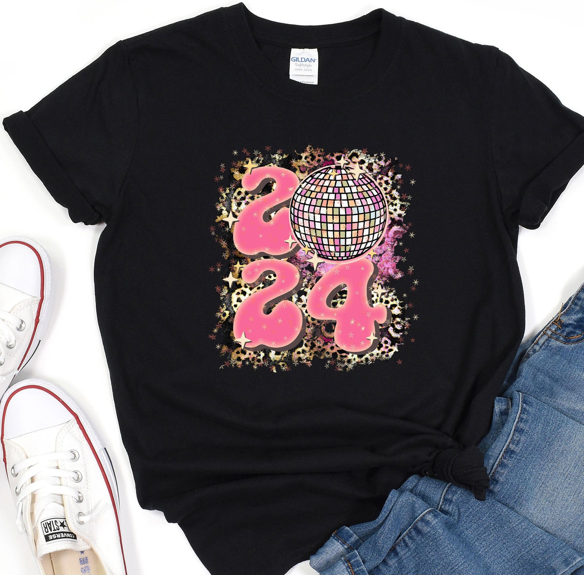 a black shirt with pink letters and a disco ball