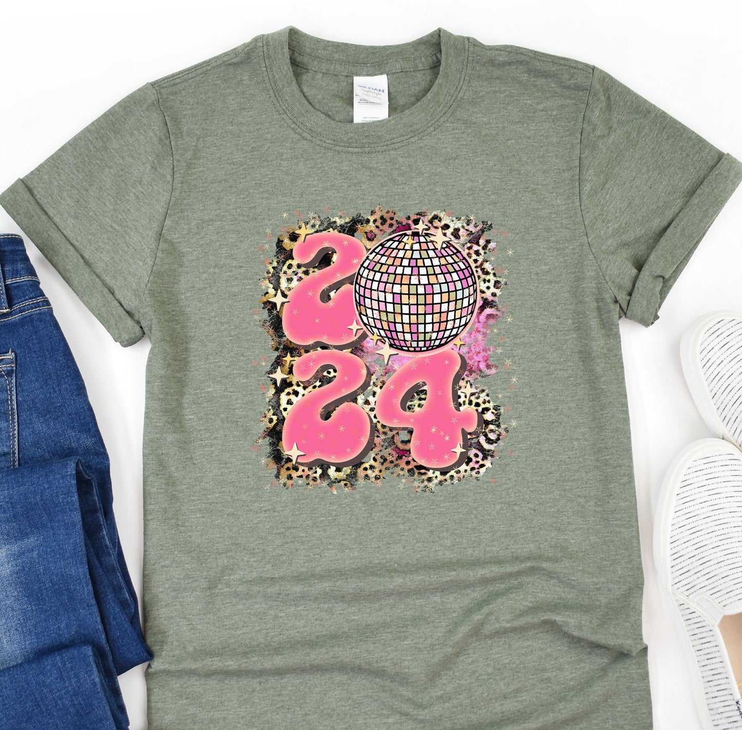 a t - shirt with a design on it next to a pair of jeans