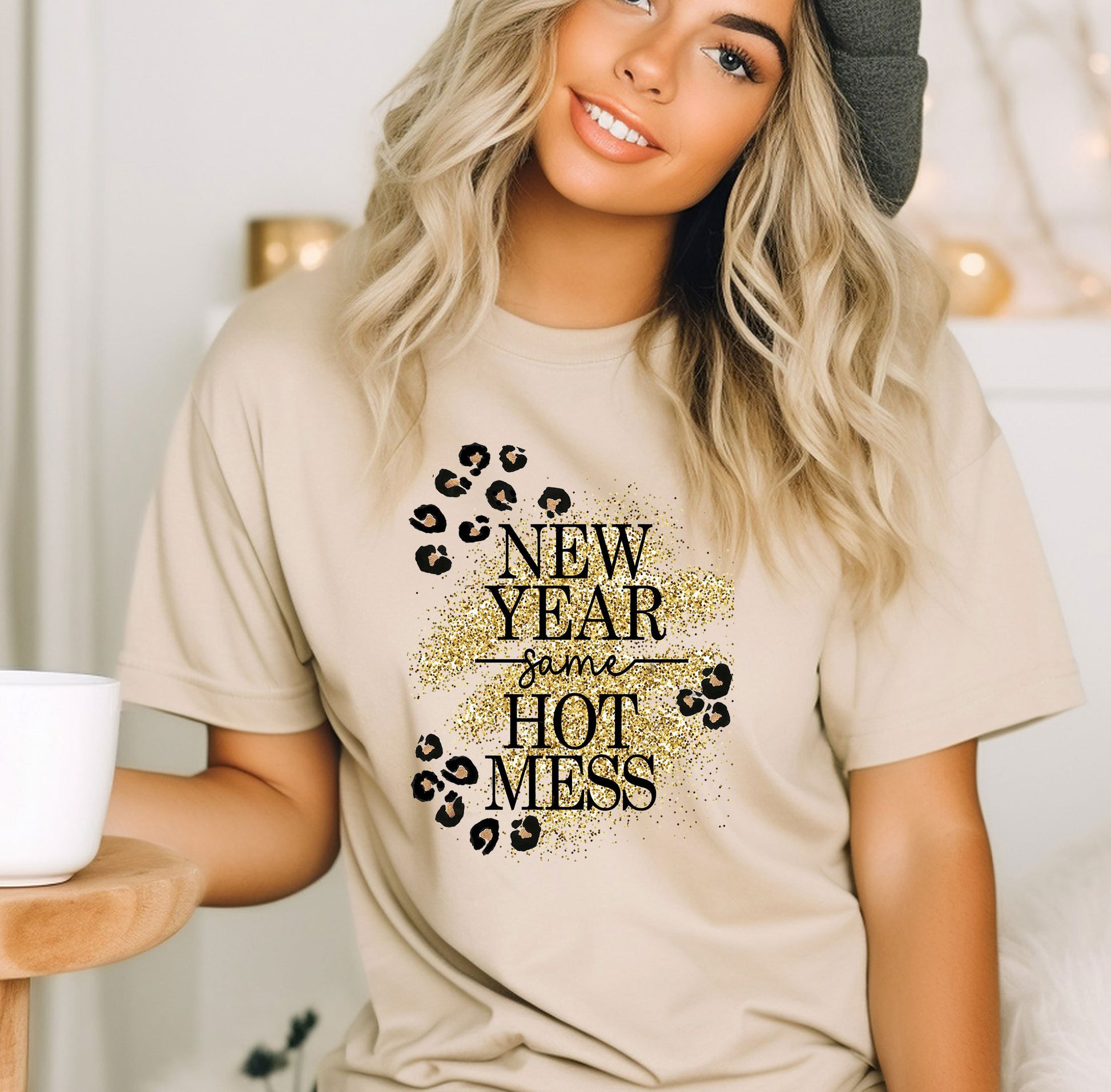 a woman wearing a new year of the hot mess t - shirt