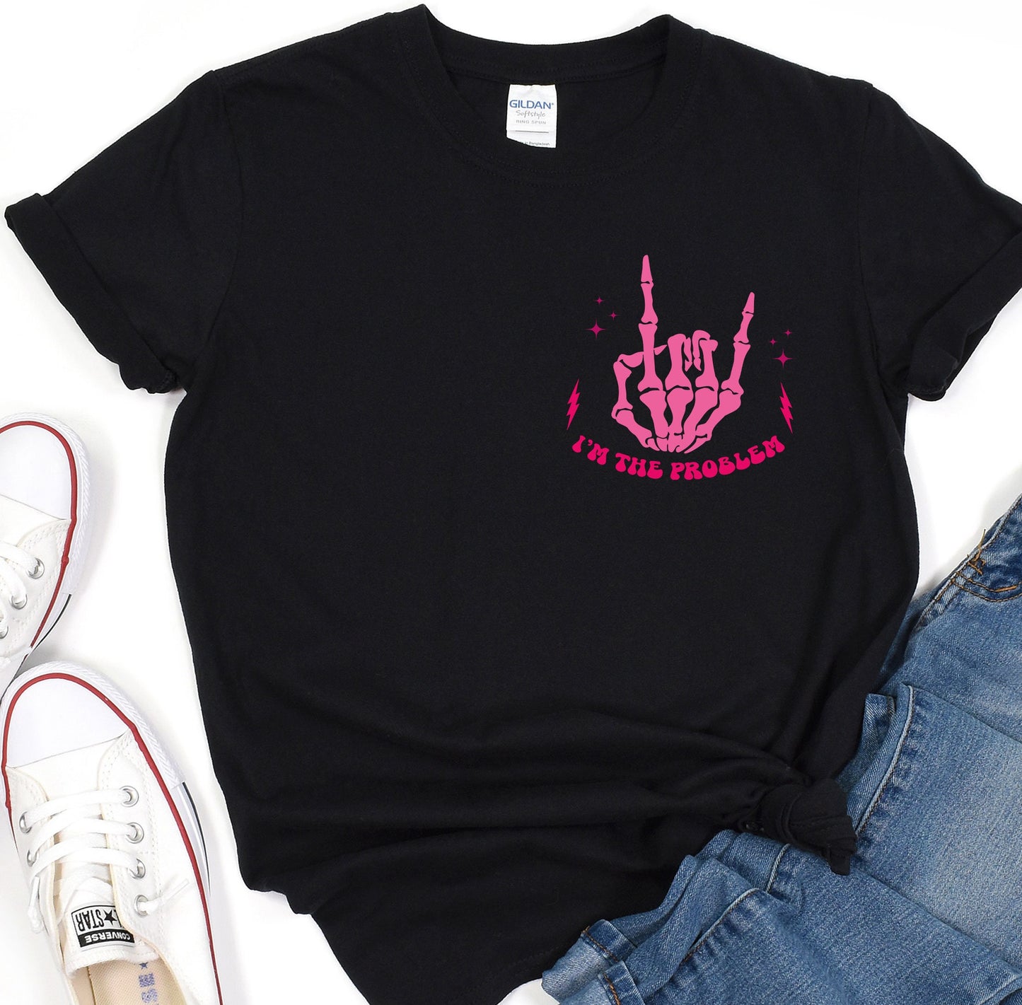 a black t - shirt with a pink design on it