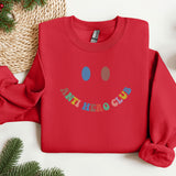 a red sweatshirt with a happy face on it