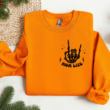 an orange sweatshirt with a hand drawn fist on it