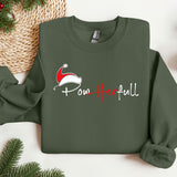 a green sweatshirt with a santa hat on it
