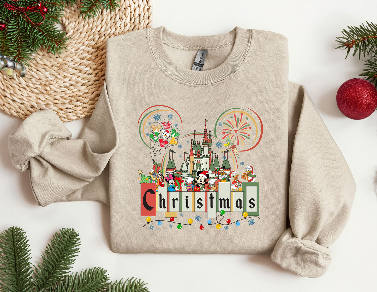 a christmas sweater with a castle and fireworks on it