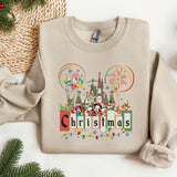a christmas sweater with a castle and fireworks on it