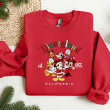 a red sweatshirt with a group of cartoon characters on it