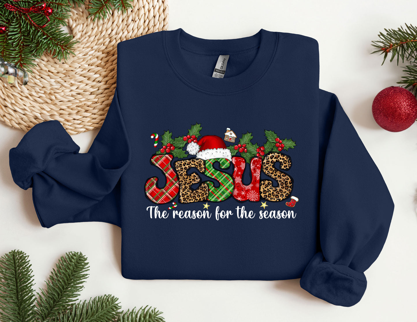 a christmas sweater with the word jesus on it