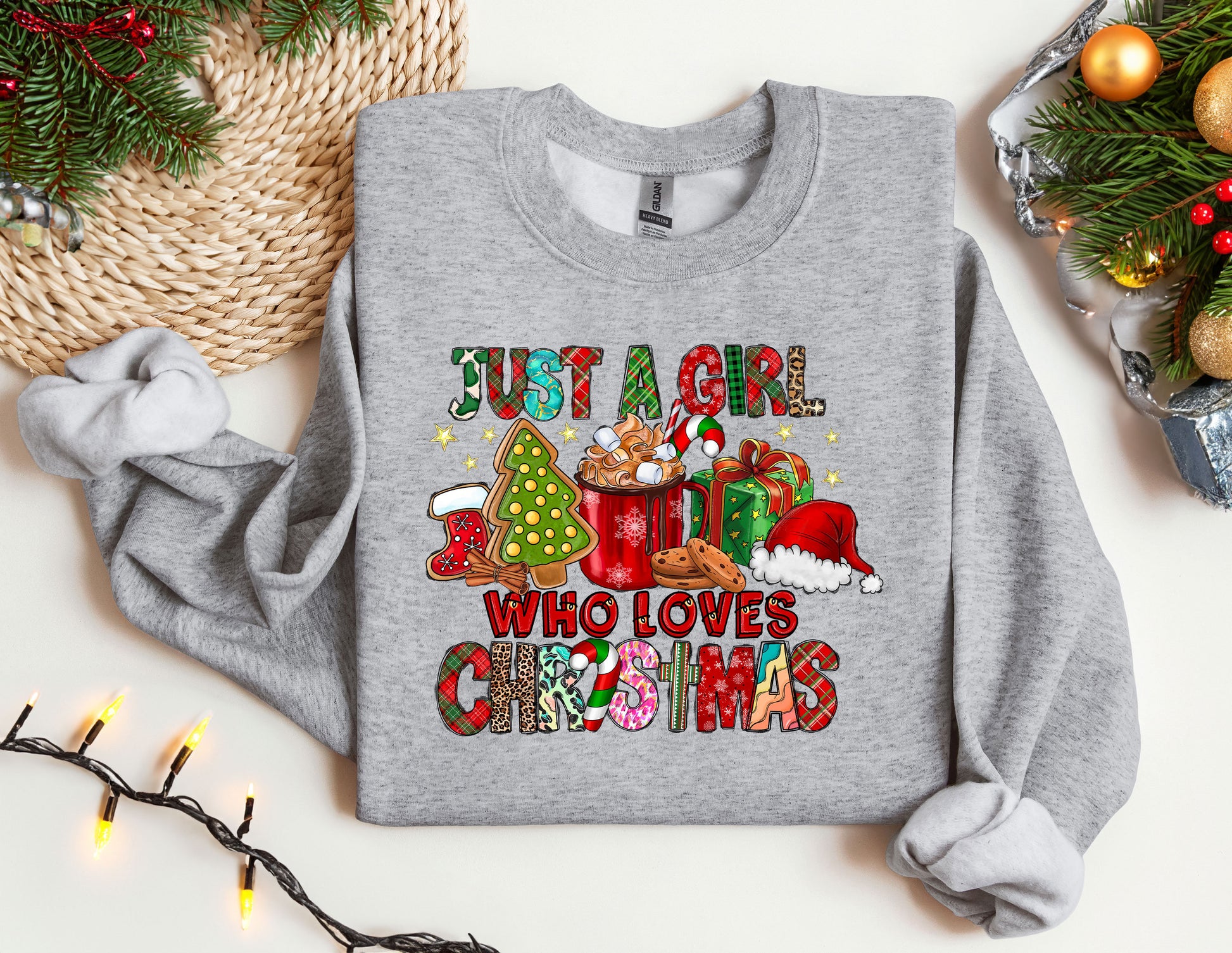 a gray sweatshirt with a christmas message on it