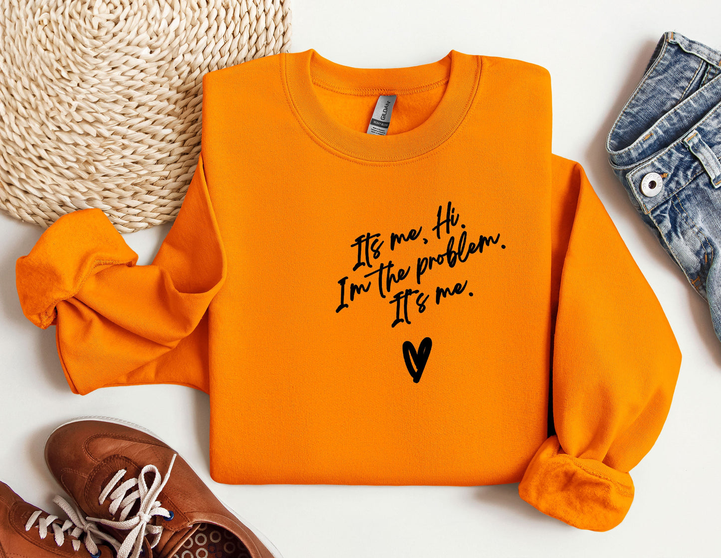a pair of shoes and an orange shirt with a message on it