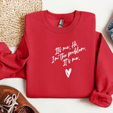 a red sweatshirt with a heart and a pair of sneakers